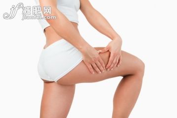 20到24歲,腹部,美女,美,橘皮組織_gic9718193_Fit woman touching her thigh against a white background_創(chuàng)意圖片_Getty Images China